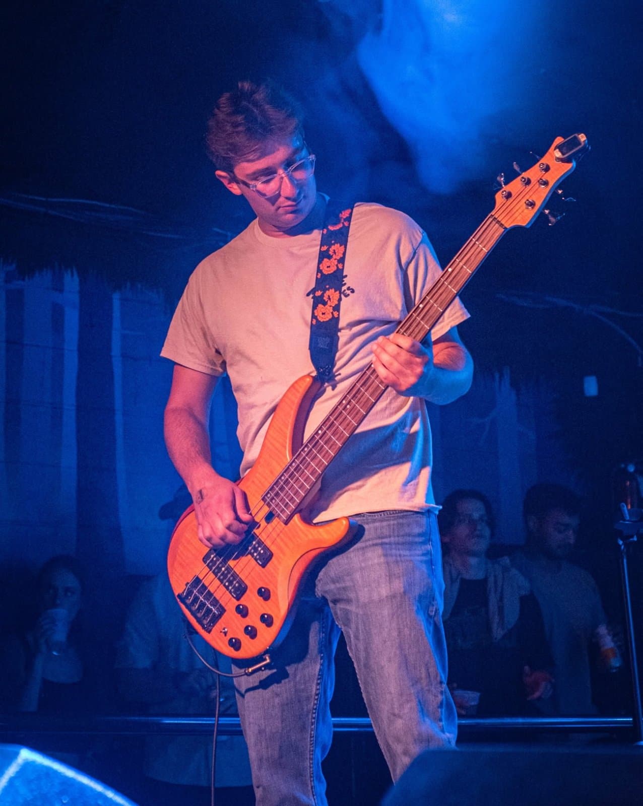 Bradley Schwartz playing bass on stage